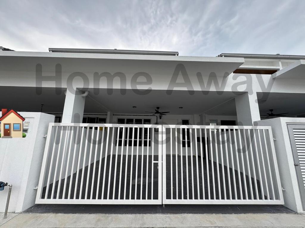 a white gate in front of a white house at Home Away Homestay in Siliau