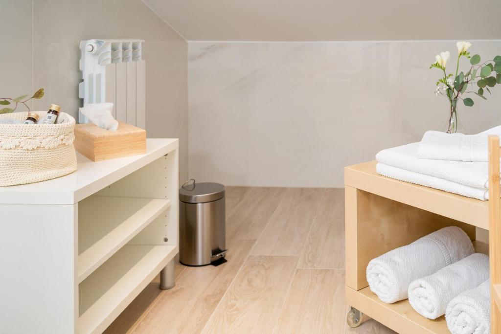 Łóżko lub łóżka w pokoju w obiekcie Otium Rooms / Camere e Appartamenti