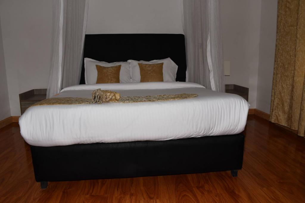 Postel nebo postele na pokoji v ubytování Tawala Garden Hotel