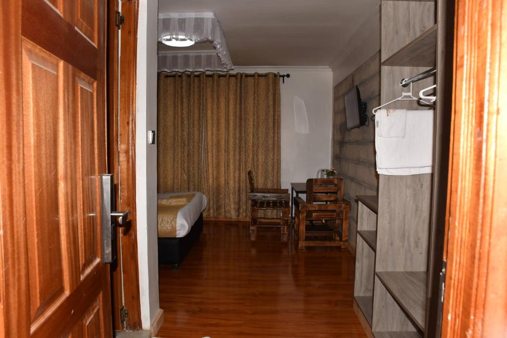 Postel nebo postele na pokoji v ubytování Tawala Garden Hotel