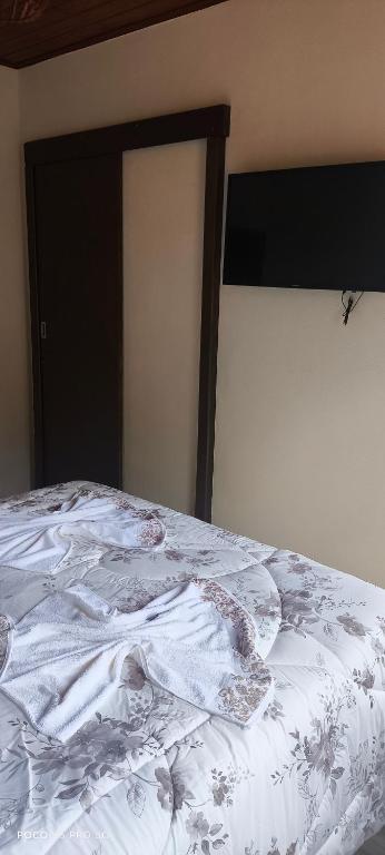 Postel nebo postele na pokoji v ubytování Chalés Vitória