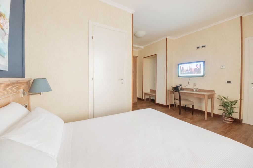 Postel nebo postele na pokoji v ubytování Green Hotel Poggio Regillo