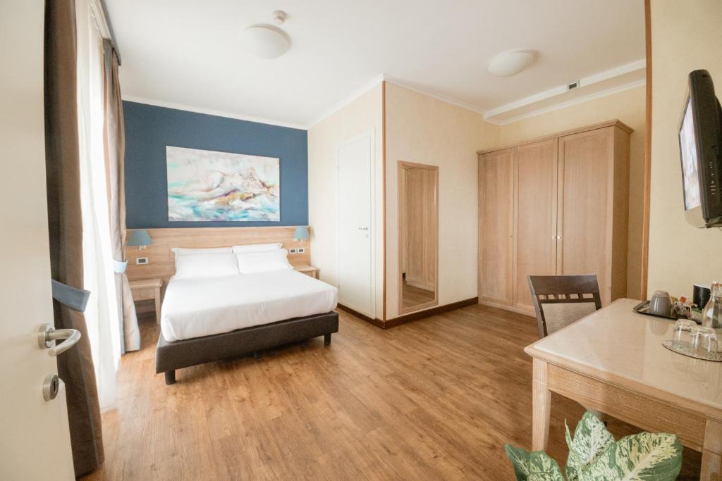 Postel nebo postele na pokoji v ubytování Green Hotel Poggio Regillo