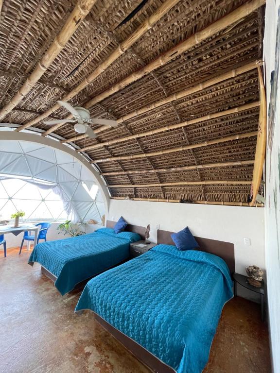 Postel nebo postele na pokoji v ubytování Glamping Burbuja