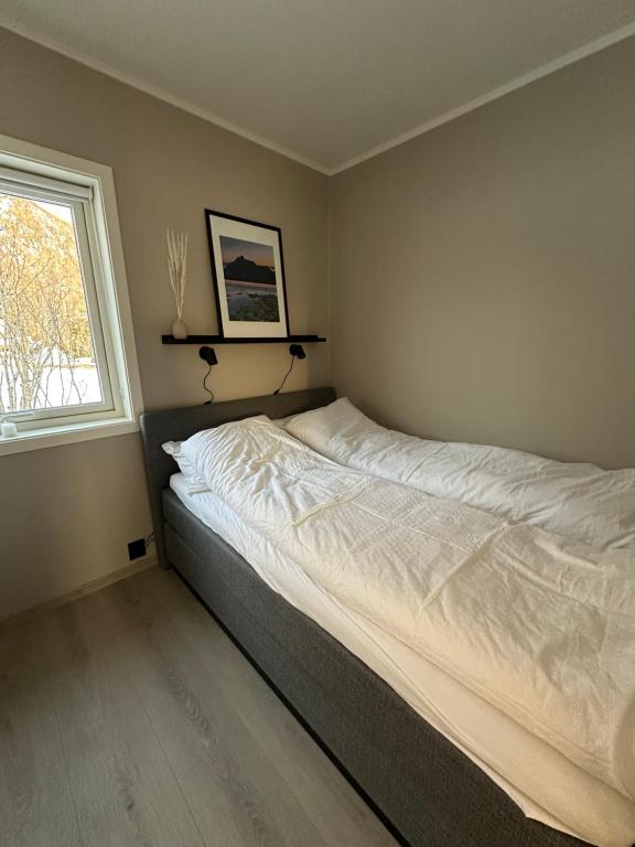 En eller flere senge i et værelse på Tindgaard apartment