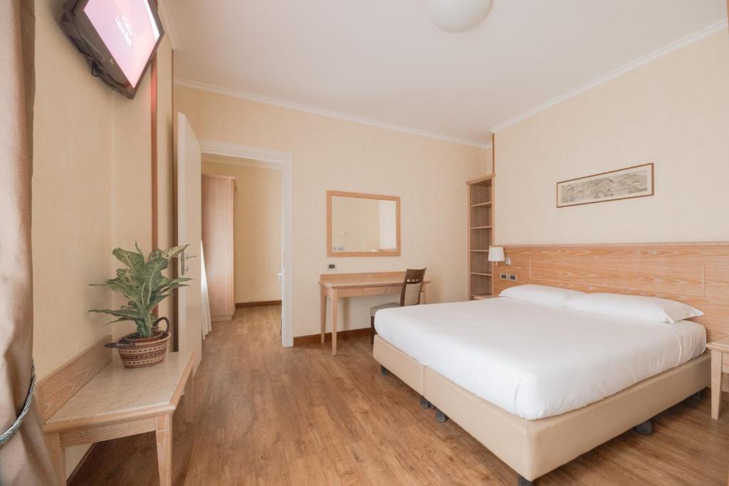 Postel nebo postele na pokoji v ubytování Green Hotel Poggio Regillo