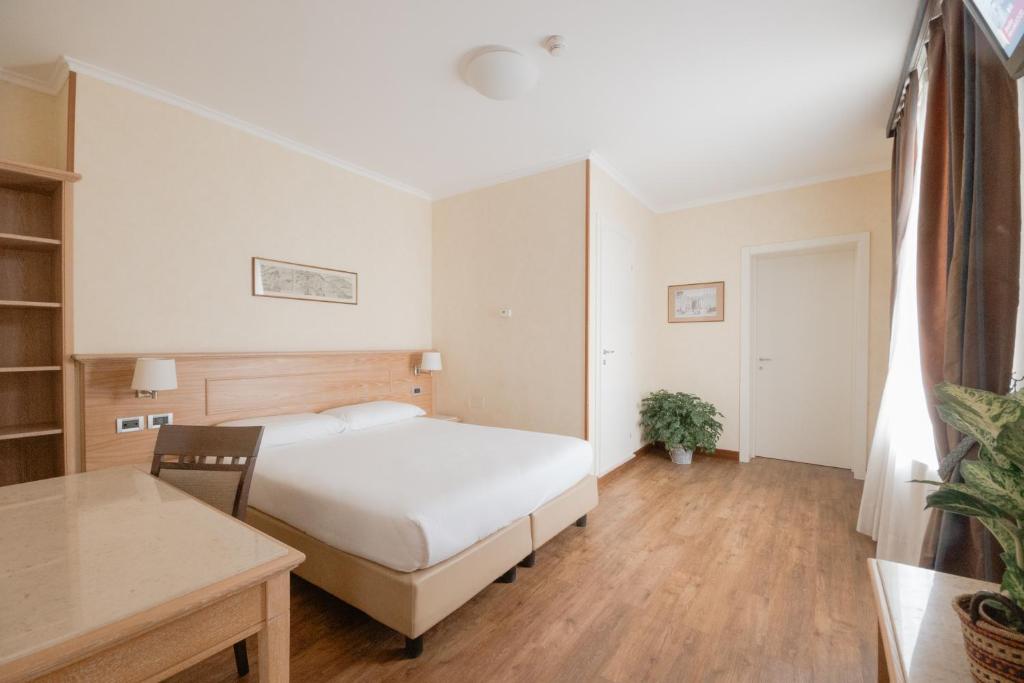 Postel nebo postele na pokoji v ubytování Green Hotel Poggio Regillo