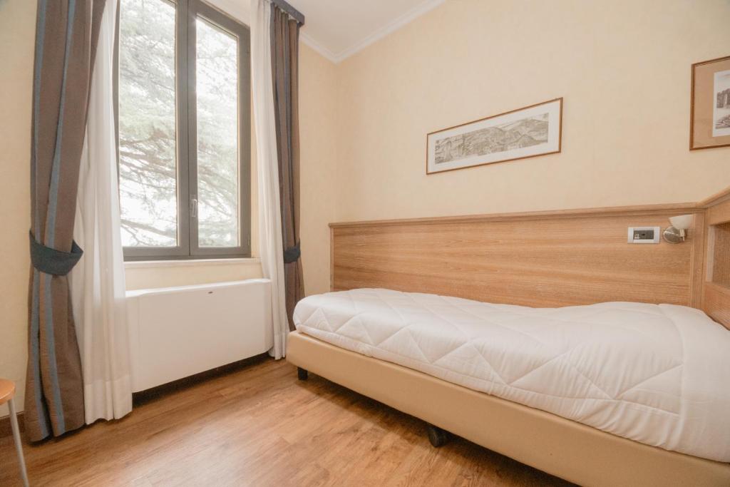 Postel nebo postele na pokoji v ubytování Green Hotel Poggio Regillo