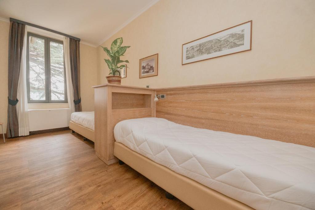 Postel nebo postele na pokoji v ubytování Green Hotel Poggio Regillo