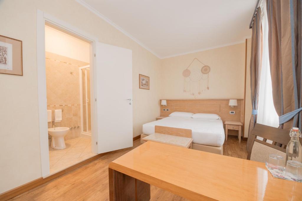 Postel nebo postele na pokoji v ubytování Green Hotel Poggio Regillo
