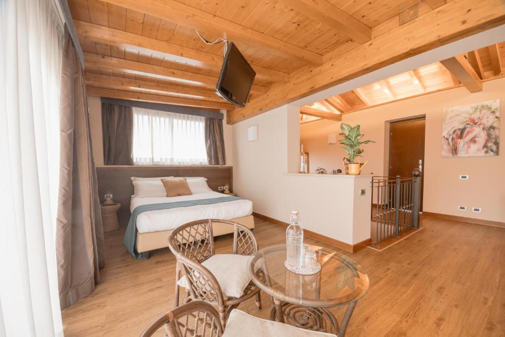 Postel nebo postele na pokoji v ubytování Green Hotel Poggio Regillo