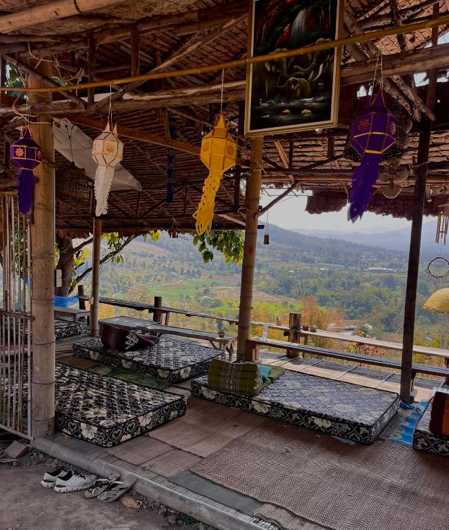 a view from the top of a building with umbrellas at Hula Hula Sunset, Dome in Pai