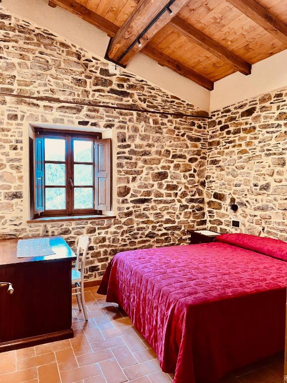 A bed or beds in a room at Agriturismo Montagna Verde Apella