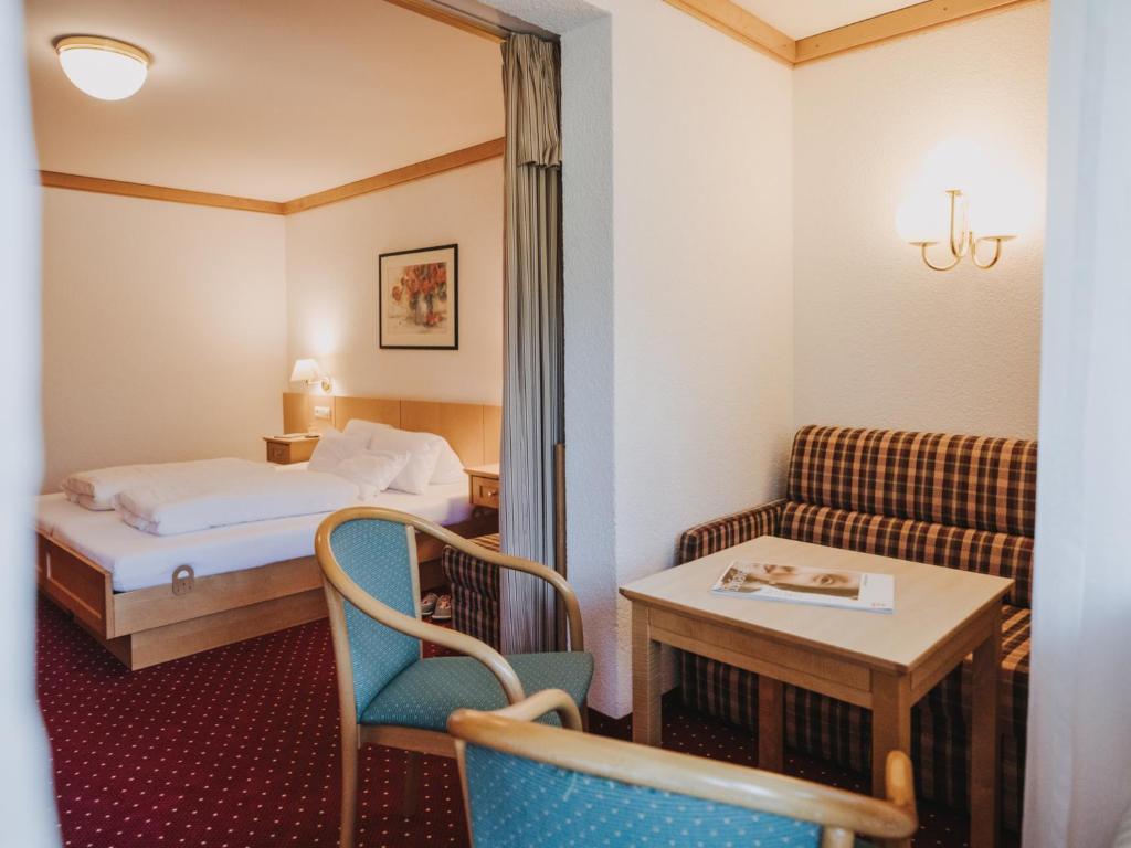 Postel nebo postele na pokoji v ubytování Hotel Zimba