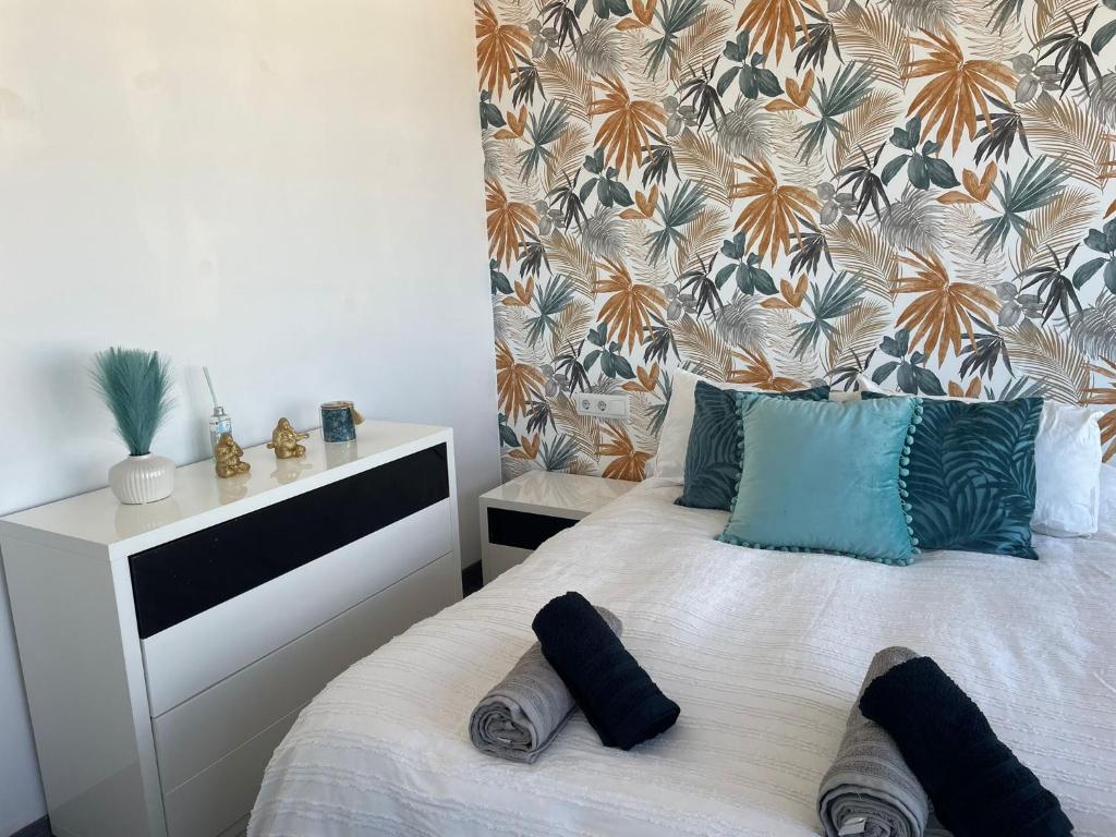 Postel nebo postele na pokoji v ubytování Apartamento Bonaire-primera linea playa