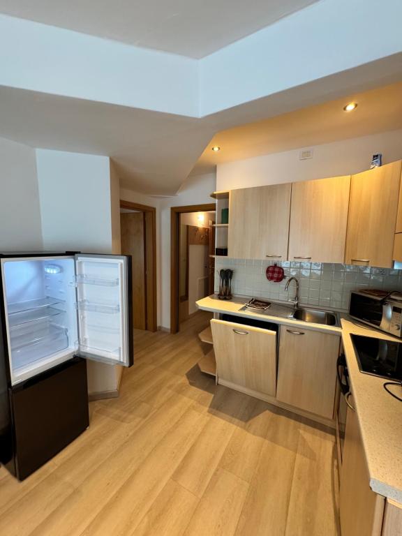 Kuchyň nebo kuchyňský kout v ubytování Doss della Pesa Apartment