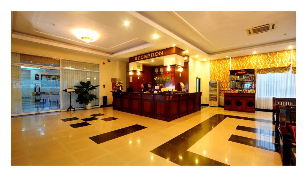 a lobby with a bar in the middle of a building at Duy Tan 2 Hotel in Hue