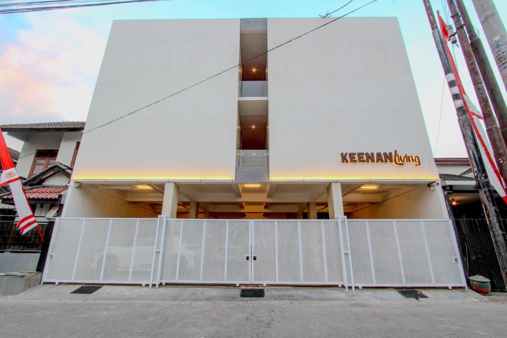 a building with a sign on the side of it at Keenan Living Perumnas in Yogyakarta
