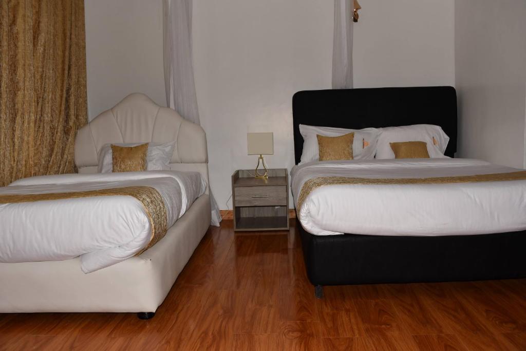 Postel nebo postele na pokoji v ubytování Tawala Garden Hotel