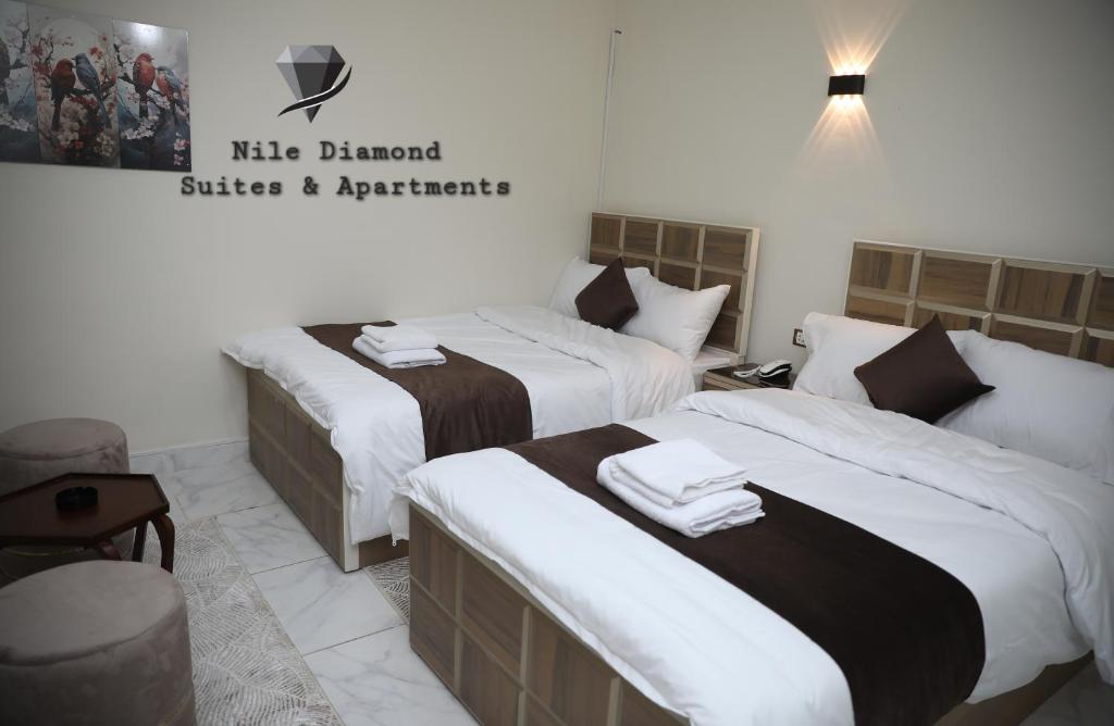 Postel nebo postele na pokoji v ubytování Nile Diamond Suites