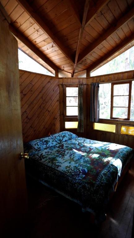 Postel nebo postele na pokoji v ubytování Cabanas Curi-Huapi
