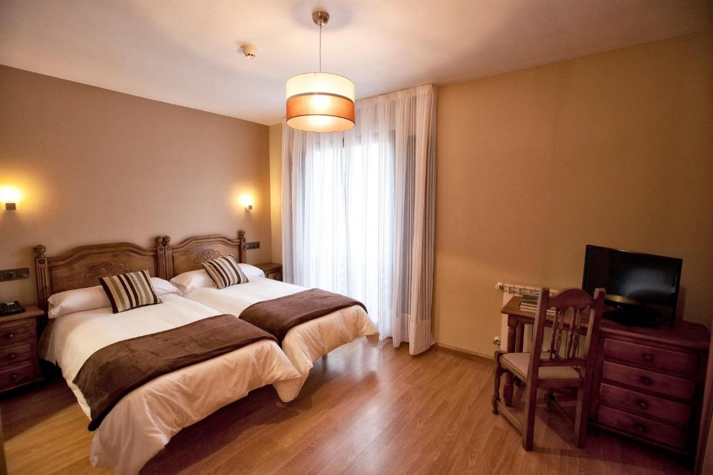 Cama o camas de una habitación en Hotel Santa Cruz