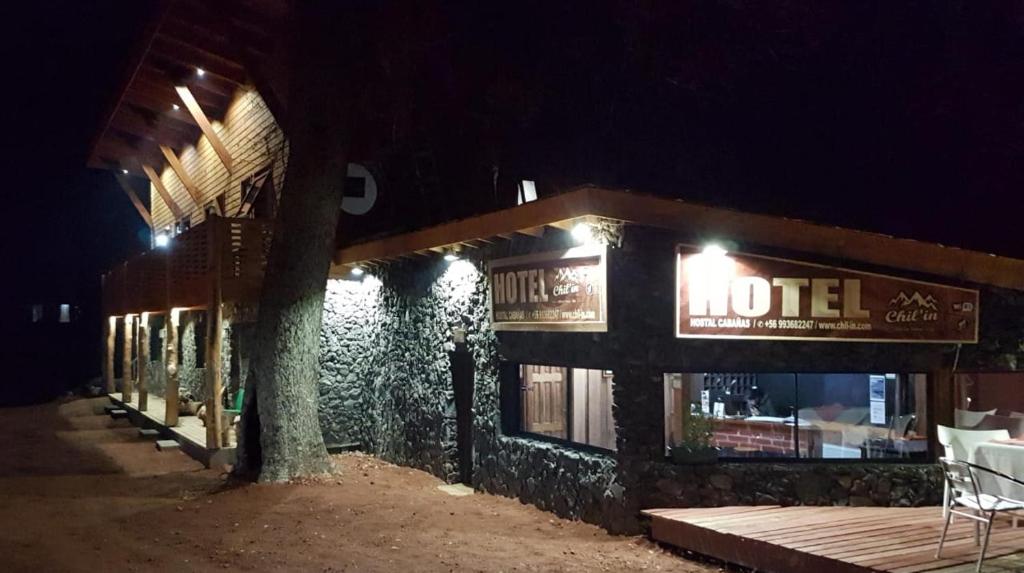 a hotel at night with a sign on it at HOTEL & HOSTAL CHIL'IN, Las Trancas in Las Trancas