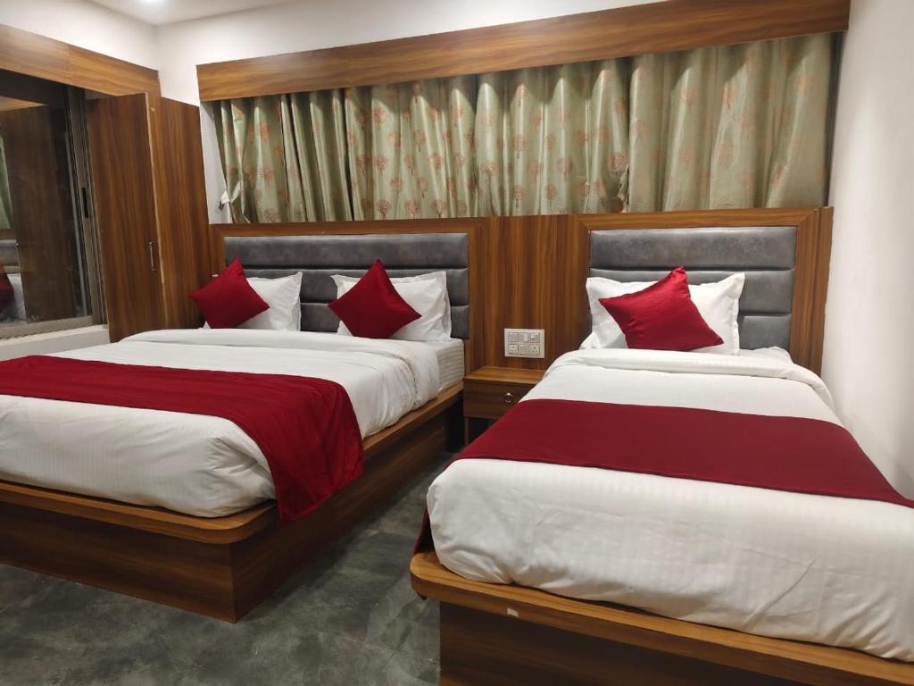 Postel nebo postele na pokoji v ubytování Hotel Maruti R