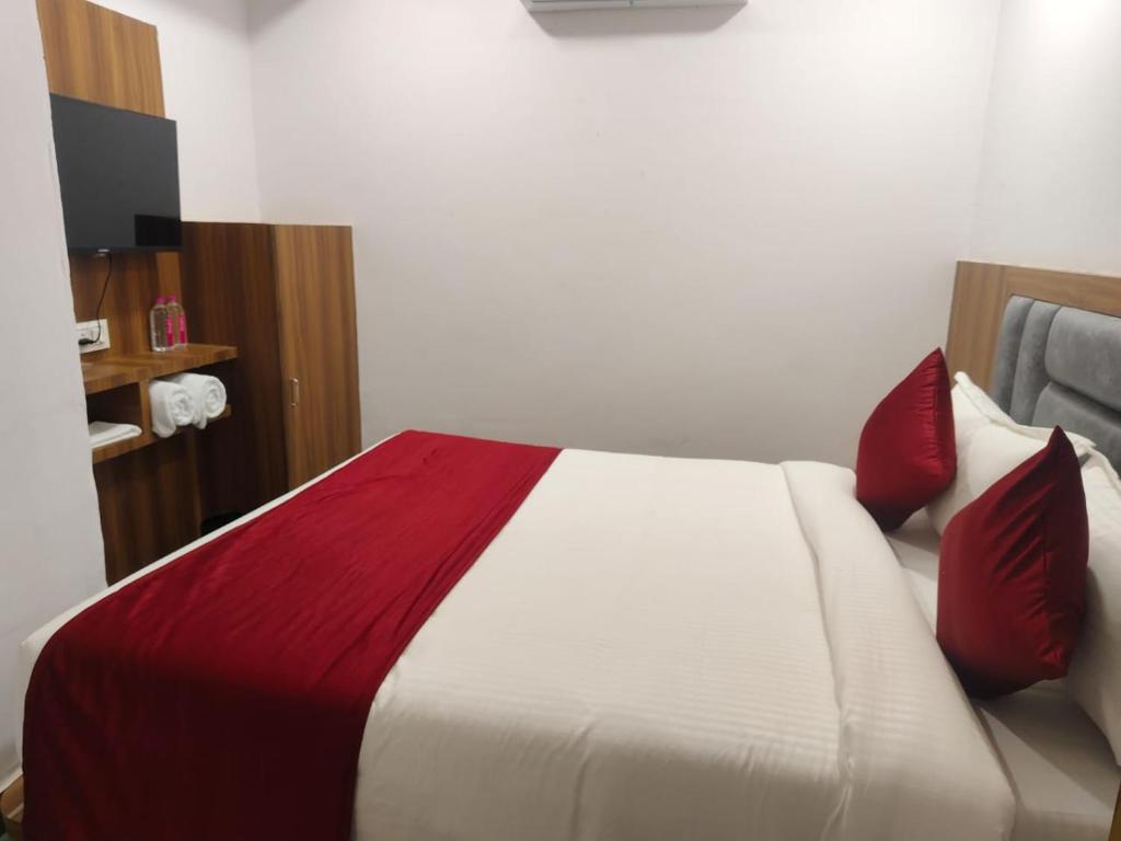 Postel nebo postele na pokoji v ubytování Hotel Maruti R