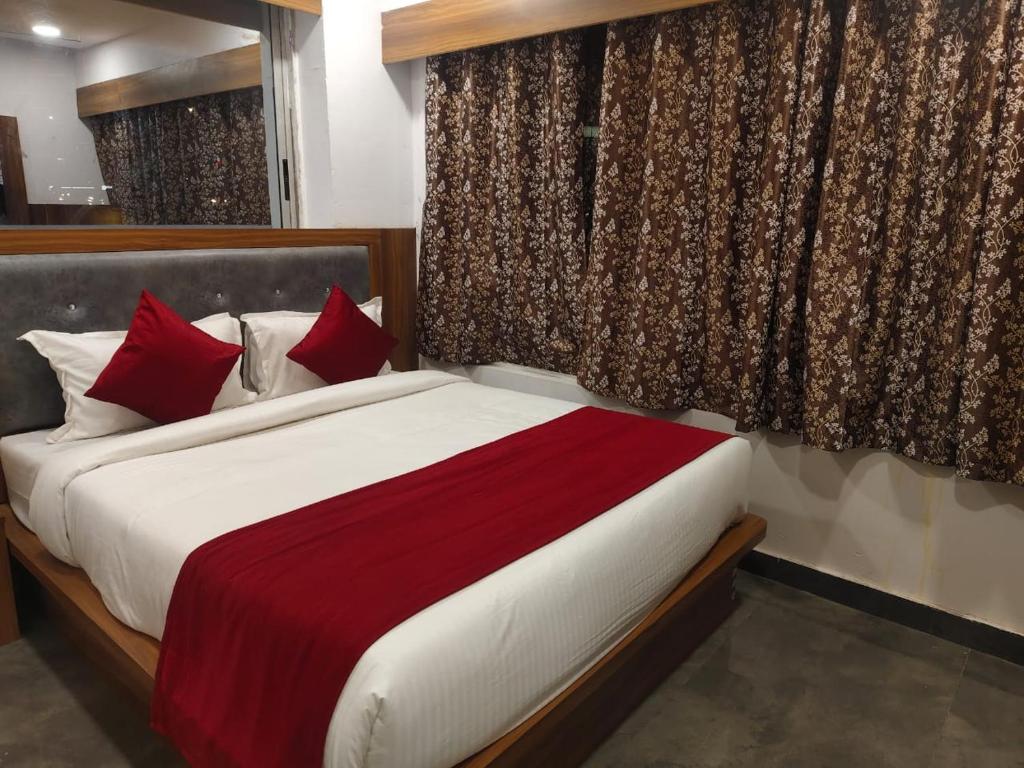 Postel nebo postele na pokoji v ubytování Hotel Maruti R