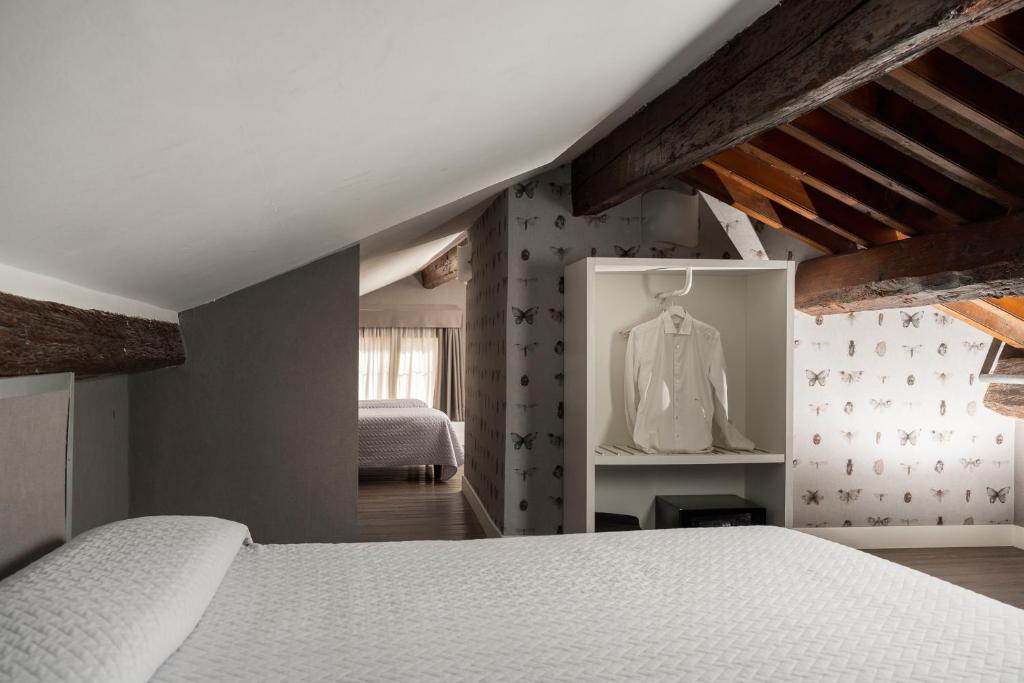 Postel nebo postele na pokoji v ubytování Maxxim Hotel & Loft