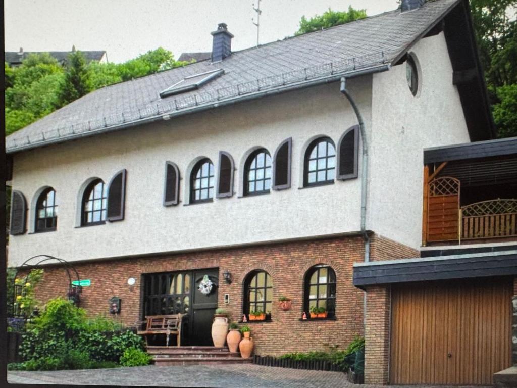 a large brick house with pumpkins in front of it at Ferienwohnung Danielle Kessler in Idar-Oberstein