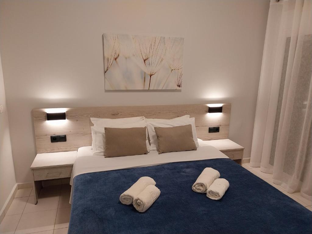 Postel nebo postele na pokoji v ubytování Eleni Apartments