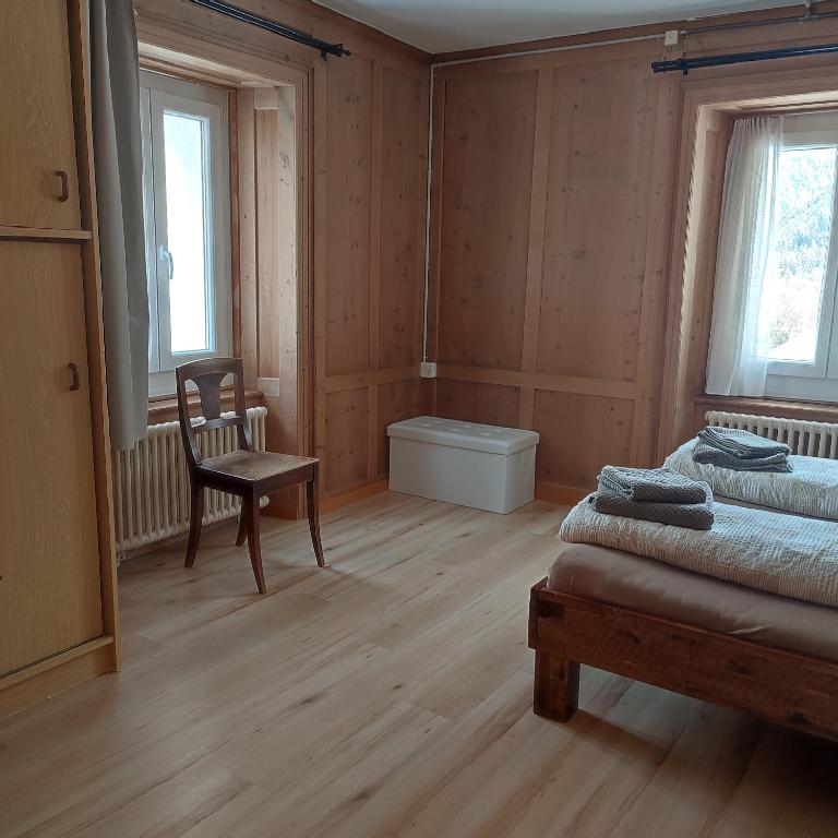 Postel nebo postele na pokoji v ubytování Haus Albula 2