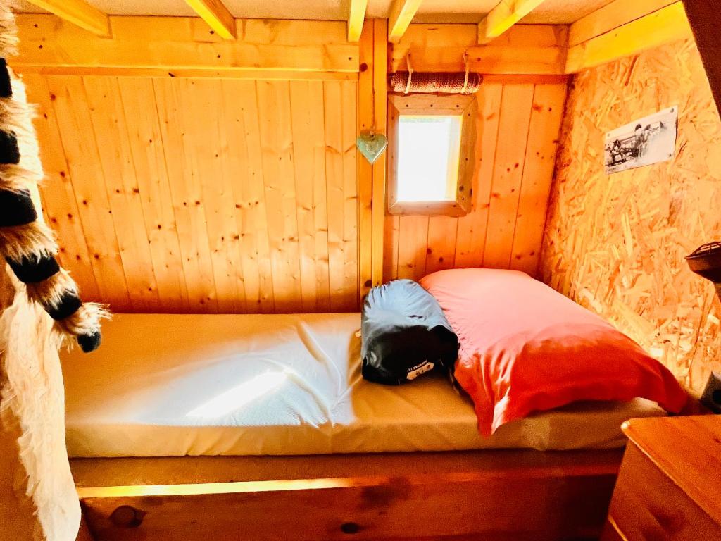 Postel nebo postele na pokoji v ubytování La cabane perchée du trappeur