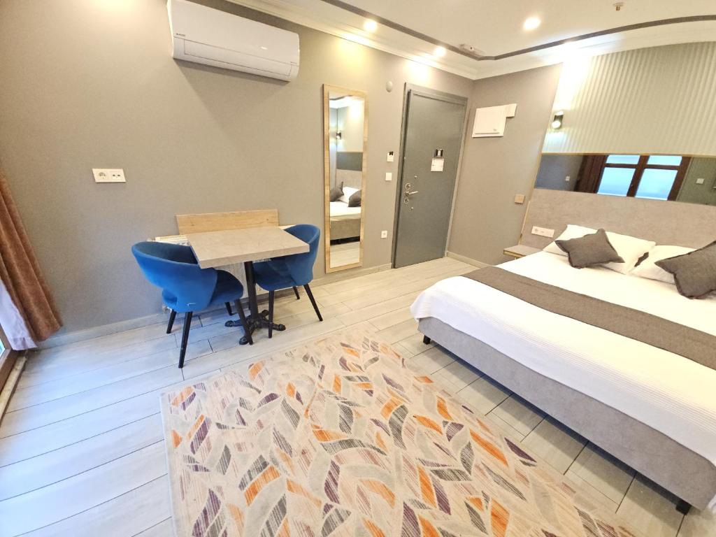 Postel nebo postele na pokoji v ubytování Sahrakent Otel Pendik