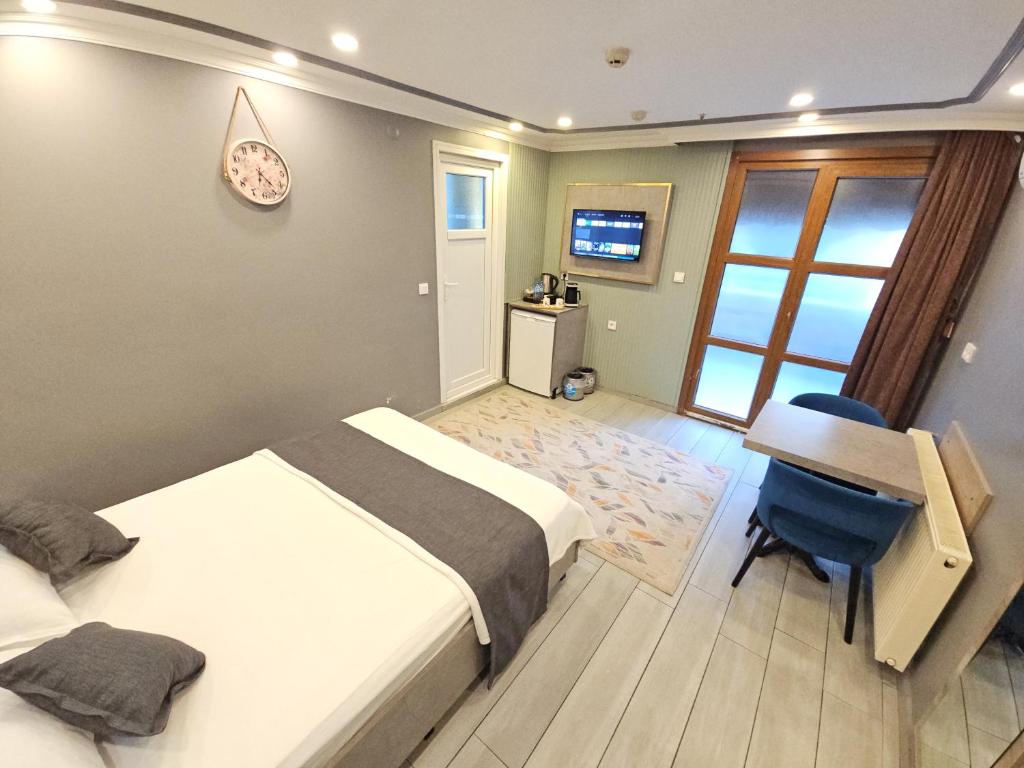 Postel nebo postele na pokoji v ubytování Sahrakent Otel Pendik