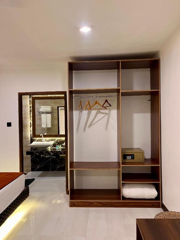 Postel nebo postele na pokoji v ubytování Sundaras Family Suites