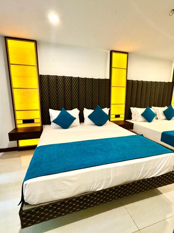 Postel nebo postele na pokoji v ubytování Sundaras Family Suites