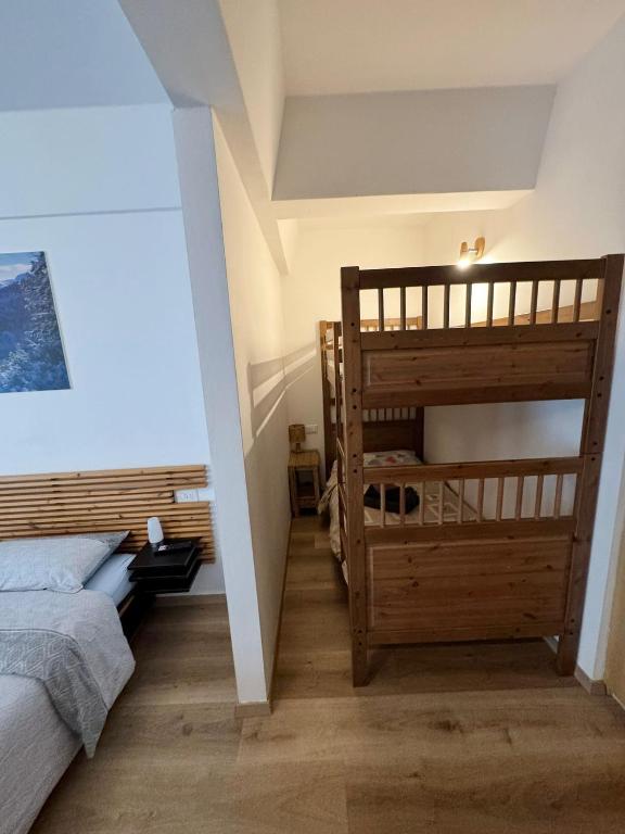 Łóżko lub łóżka w pokoju w obiekcie Genziana Apartment