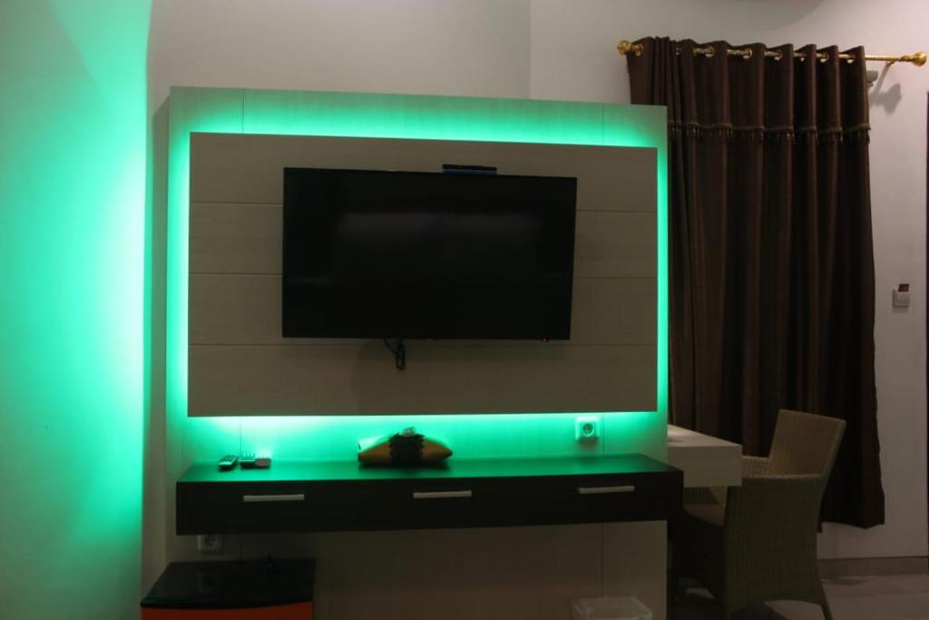 TV a/nebo společenská místnost v ubytování Tlogomas Guest House