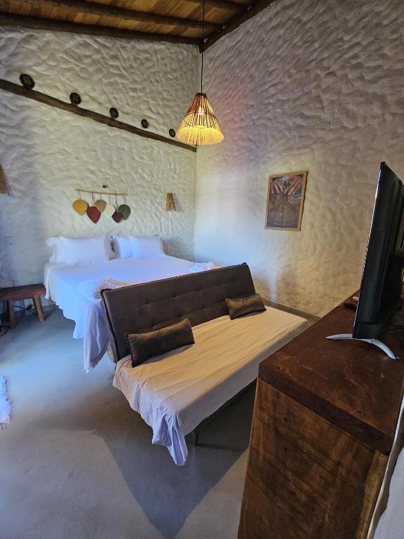 Postel nebo postele na pokoji v ubytování Pousada Suyhê
