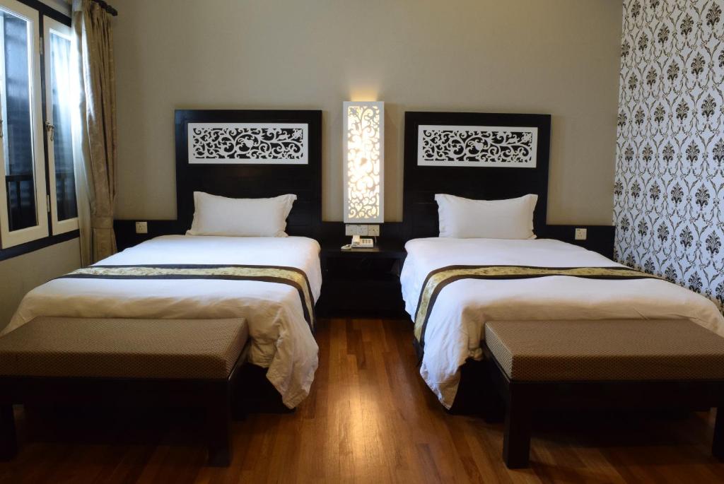 Postel nebo postele na pokoji v ubytování Jonker Boutique Hotel