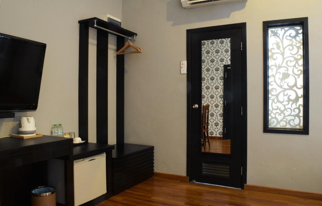 TV a/nebo společenská místnost v ubytování Jonker Boutique Hotel