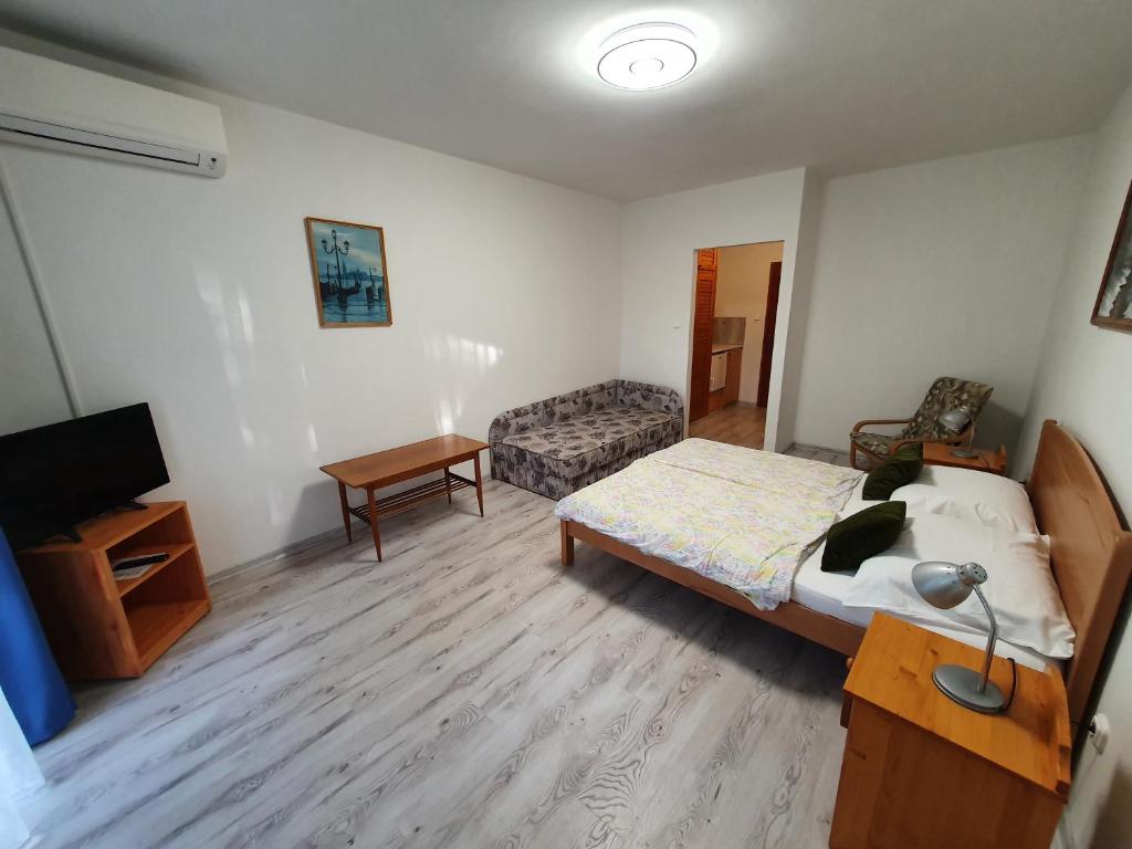 Postel nebo postele na pokoji v ubytování Arizona apartman