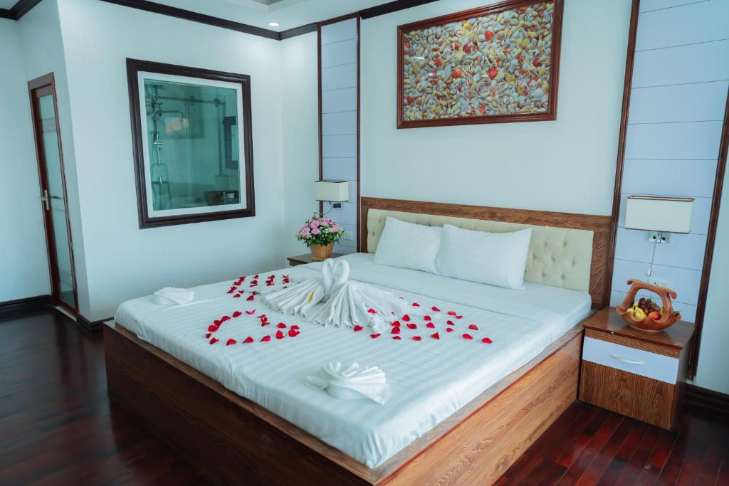 Postel nebo postele na pokoji v ubytování Vientiane Ruby Riverside Hotel