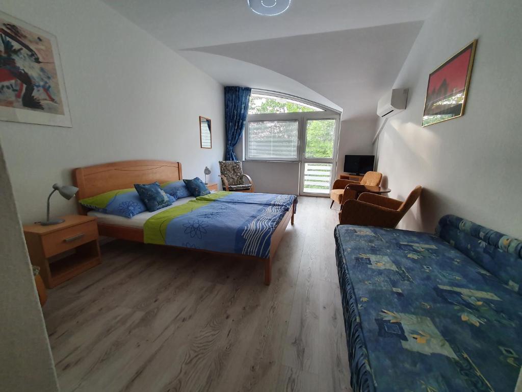 Postel nebo postele na pokoji v ubytování Arizona apartman