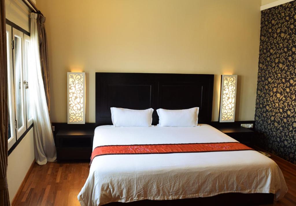 Postel nebo postele na pokoji v ubytování Jonker Boutique Hotel