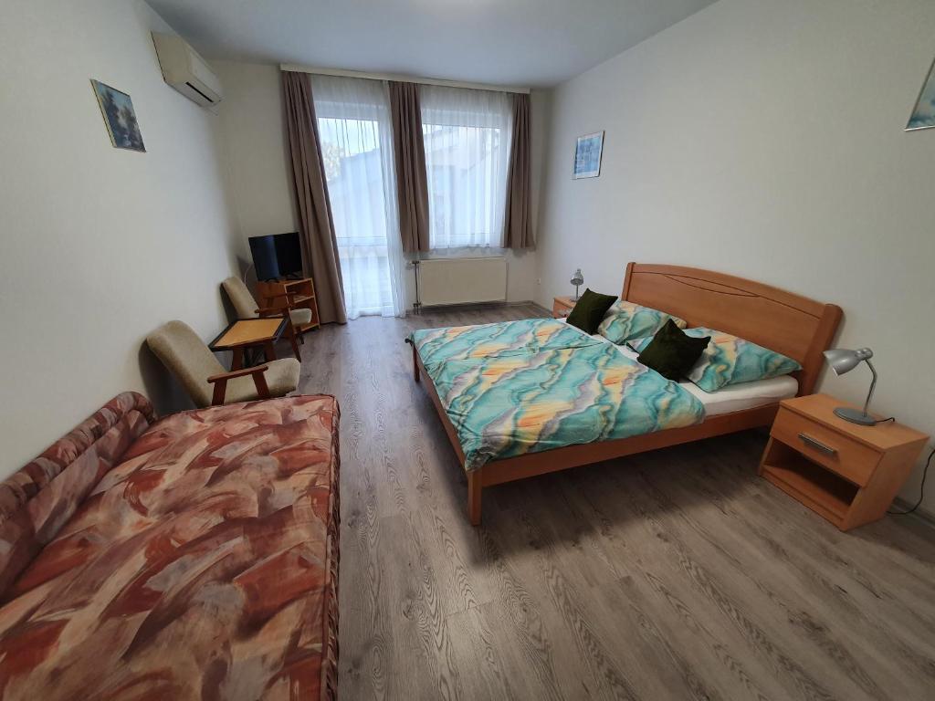 Postel nebo postele na pokoji v ubytování Arizona apartman