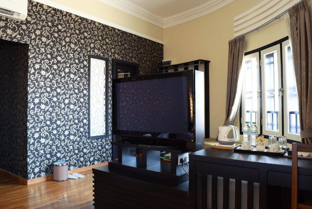 TV a/nebo společenská místnost v ubytování Jonker Boutique Hotel